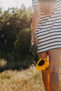 Woman with Sunflower | Suzanne Polino REALTOR